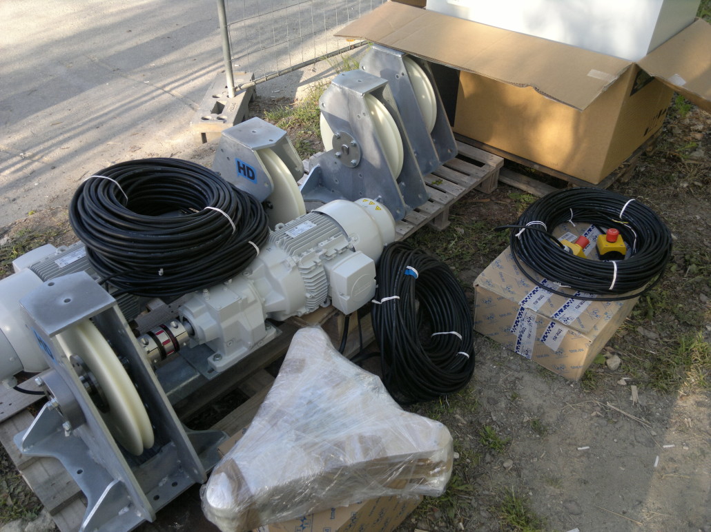 Team assembling a Zero Gravity cable system tower during installation